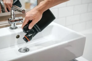 pouring drain cleaner down the sink